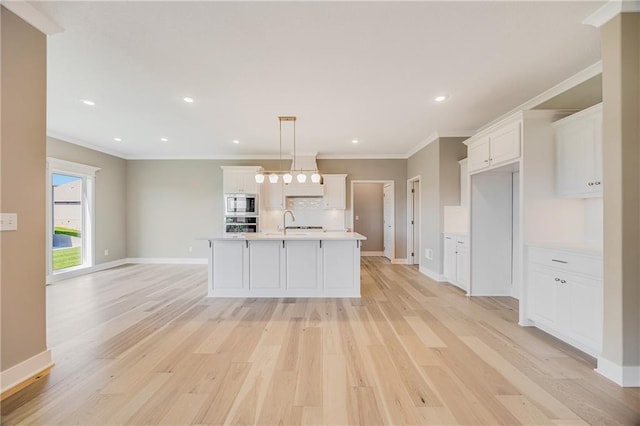 7009 NE 103rd St, Kansas City, MO 64156 - kitchen with appliances with stainless steel finishes, light countertops, ornamental molding, white cabinets, and light wood-type flooring