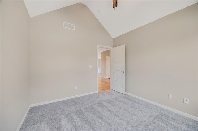 7009 NE 103rd St, Kansas City, MO 64156 - unfurnished room featuring light colored carpet and high vaulted ceiling