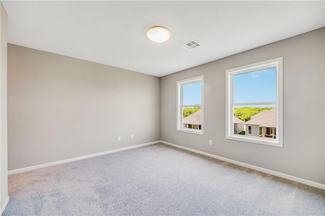 7009 NE 103rd St, Kansas City, MO 64156 - empty room featuring carpet flooring and baseboards