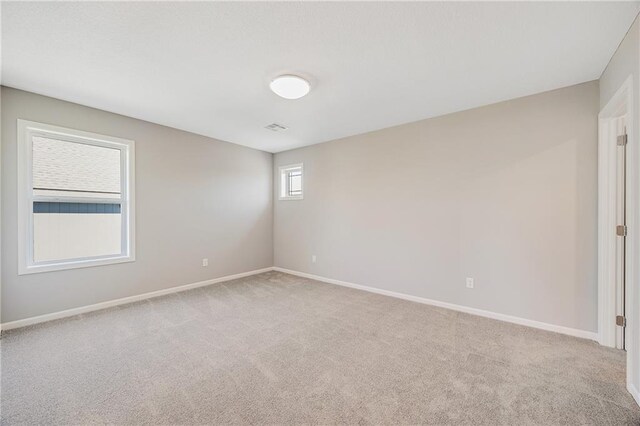 7009 NE 103rd St, Kansas City, MO 64156 - carpeted spare room featuring baseboards