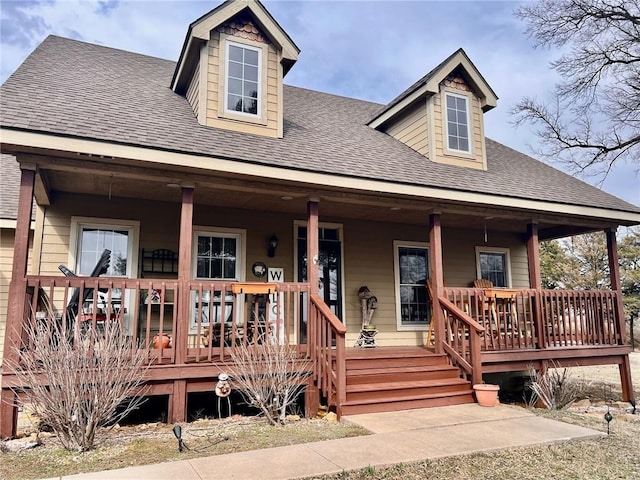 view of front of house featuring a porch and a shingled roof