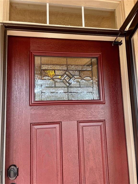 view of exterior entry with stucco siding