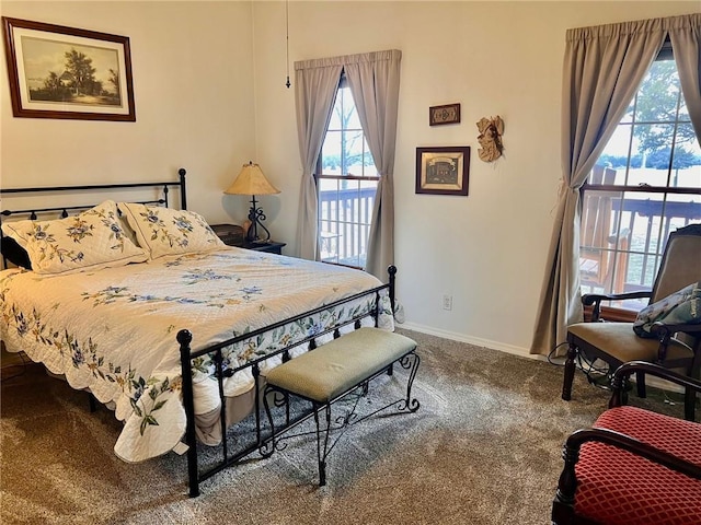 bedroom featuring carpet and baseboards