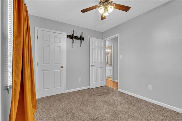 unfurnished bedroom with ceiling fan, baseboards, and carpet floors