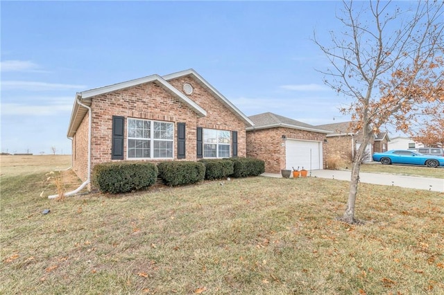 single story home featuring a garage, driveway, brick siding, and a front lawn