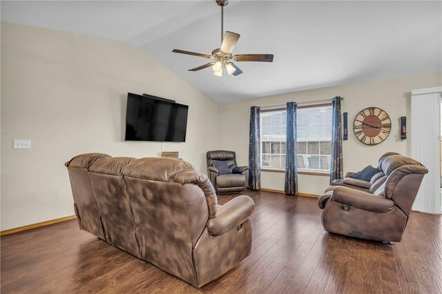 living room featuring vaulted ceiling, ceiling fan, wood finished floors, and baseboards