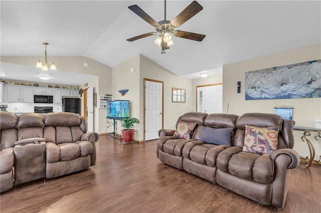 living room with vaulted ceiling, wood finished floors, and ceiling fan with notable chandelier