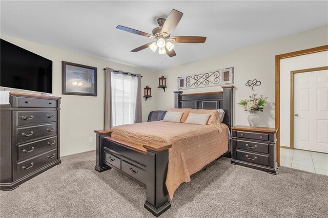 bedroom featuring a ceiling fan and light colored carpet