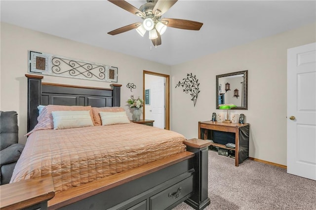 bedroom with a ceiling fan, light carpet, and baseboards