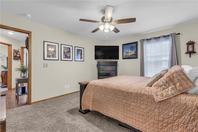 bedroom featuring a ceiling fan and baseboards