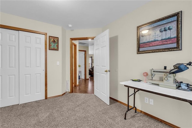 interior space with carpet and baseboards