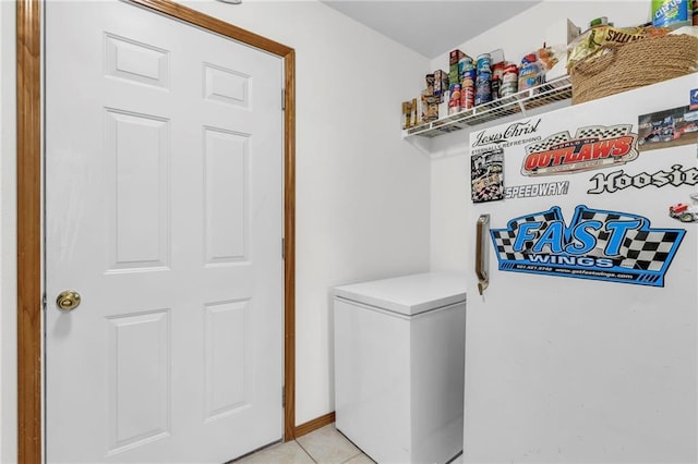 laundry room with light tile patterned floors