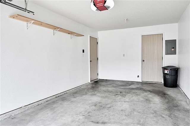 garage featuring electric panel and a garage door opener