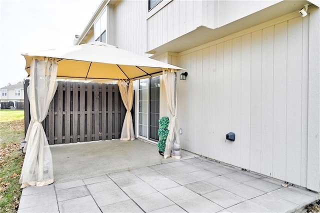 view of patio featuring fence