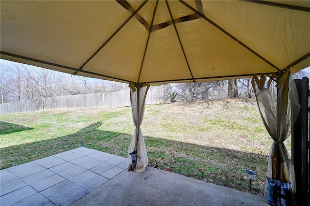 view of patio featuring a gazebo and fence