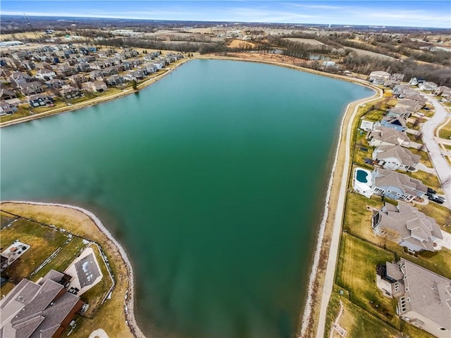 birds eye view of property featuring a residential view and a water view