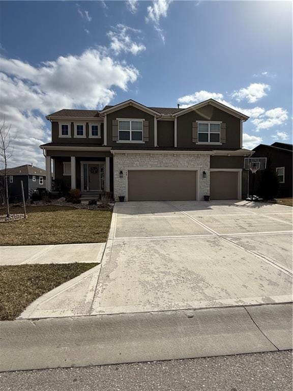 view of front of home with driveway and an attached garage