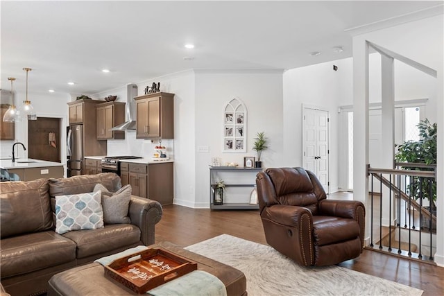 living area featuring recessed lighting, baseboards, and dark wood-style floors