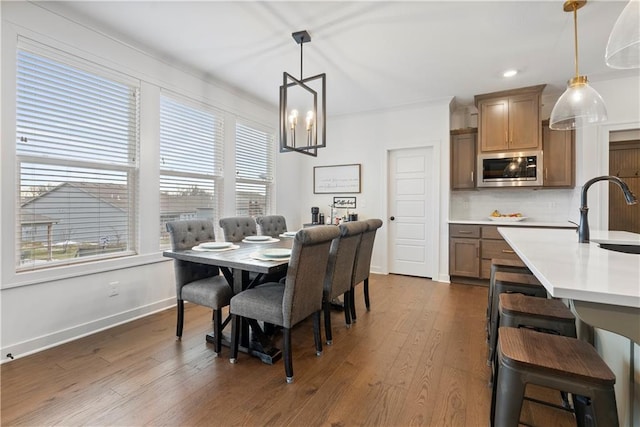 dining area featuring recessed lighting, a chandelier, baseboards, and dark wood-style floors