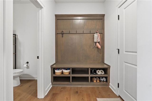 mudroom with baseboards and wood finished floors