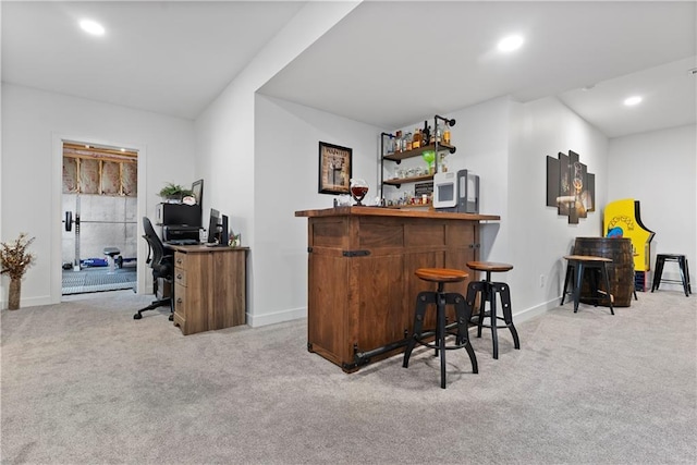 bar featuring recessed lighting, light colored carpet, baseboards, and a bar