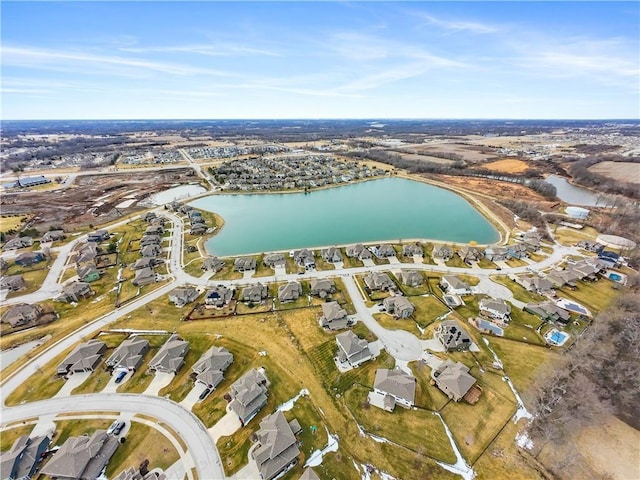 drone / aerial view with a residential view and a water view