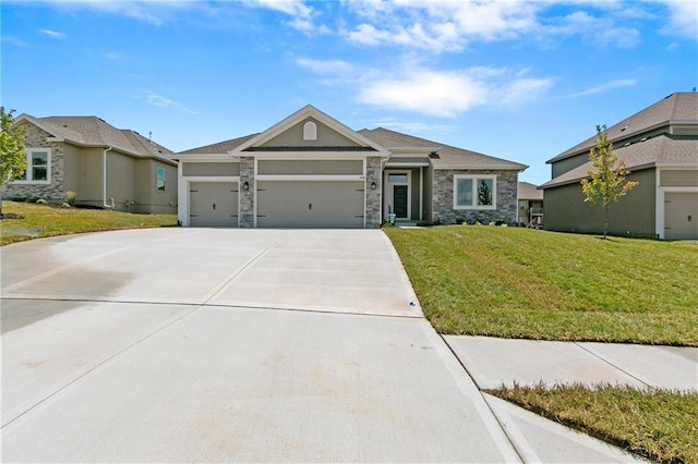 view of front of home with a garage, driveway, stone siding, and a front yard