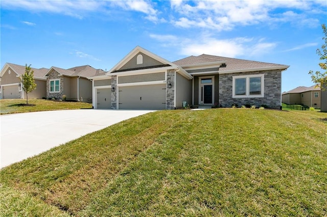 view of front of home featuring a garage, a front yard, stone siding, and driveway