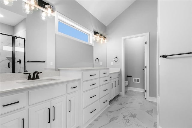 bathroom with marble finish floor, toilet, a stall shower, vaulted ceiling, and vanity