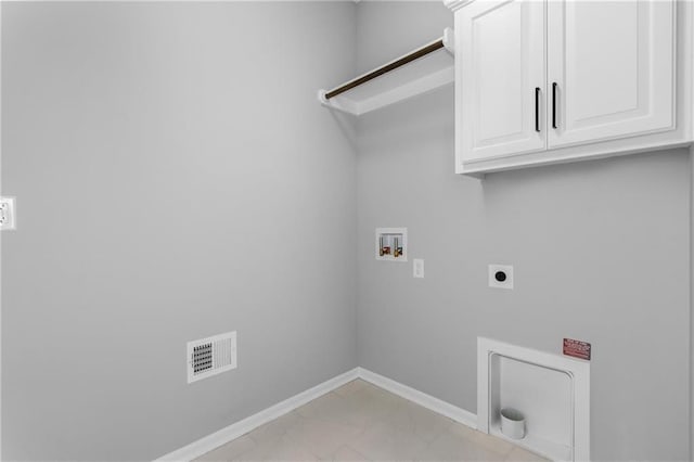 clothes washing area featuring washer hookup, visible vents, baseboards, cabinet space, and electric dryer hookup