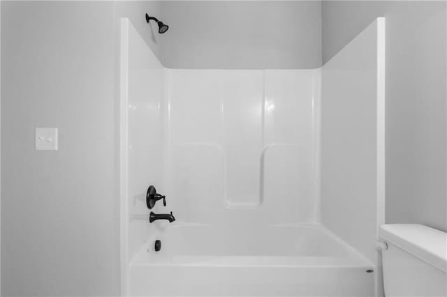 full bathroom with toilet and shower / washtub combination