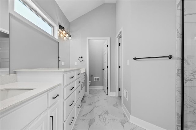 bathroom featuring toilet, visible vents, vanity, vaulted ceiling, and marble finish floor