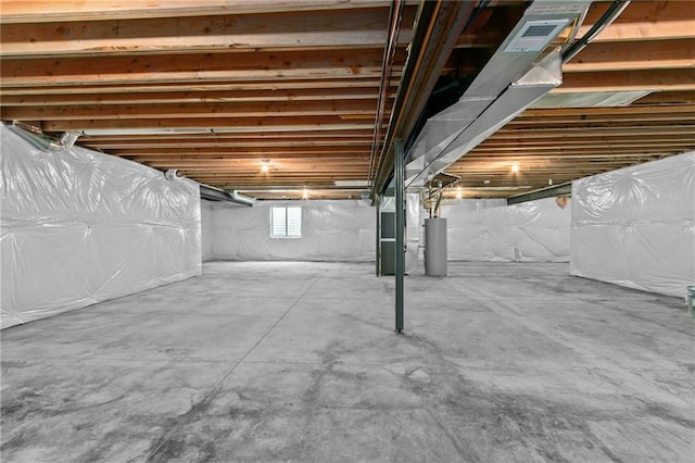 basement with water heater and visible vents