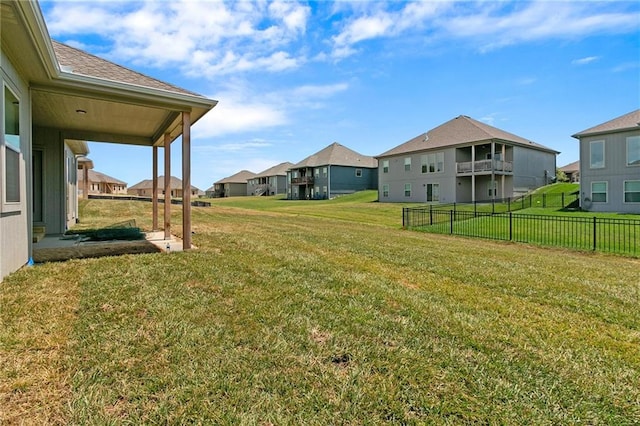 view of yard featuring a residential view and fence