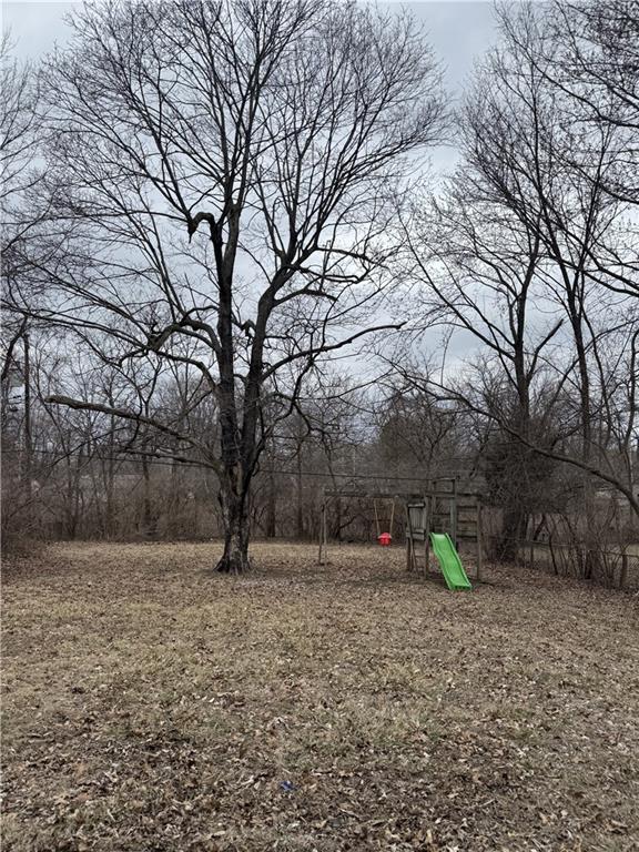 10904 Cambridge Ave, Kansas City, MO 64134 - view of yard with a playground