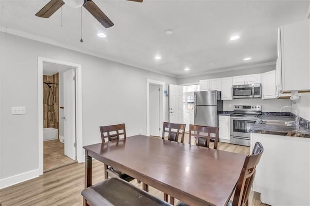 dining area featuring recessed lighting, baseboards, light wood-style floors, and ornamental molding