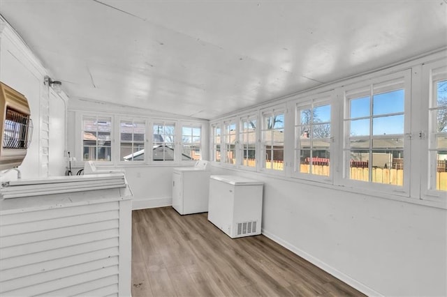 unfurnished sunroom featuring washer / clothes dryer