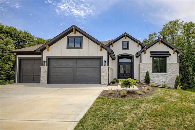 12435 NW Arbor Way, Platte City, MO 64079 - modern farmhouse with french doors, a garage, driveway, a front yard, and board and batten siding