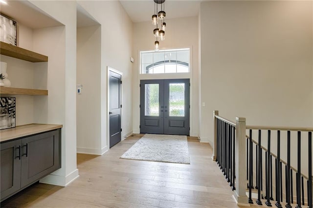 12435 NW Arbor Way, Platte City, MO 64079 - entryway featuring light wood finished floors, a high ceiling, and french doors