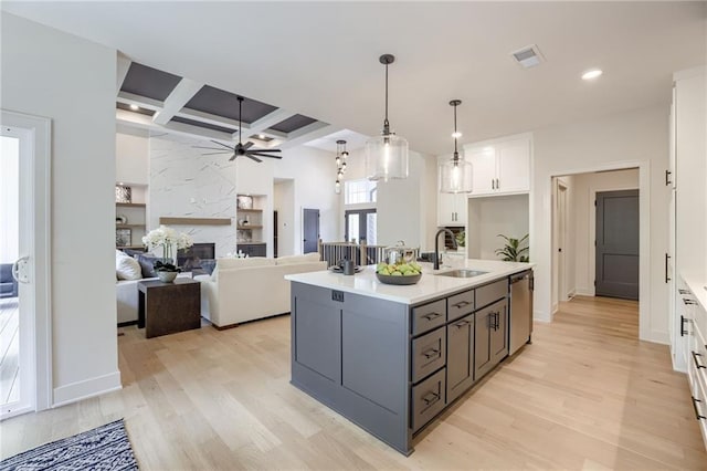 12435 NW Arbor Way, Platte City, MO 64079 - kitchen with coffered ceiling, white cabinets, a ceiling fan, light wood-style flooring, and light countertops
