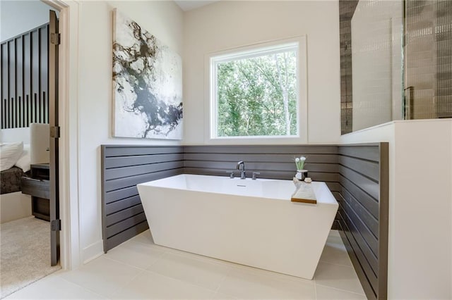 12435 NW Arbor Way, Platte City, MO 64079 - bathroom with a freestanding tub and a tile shower