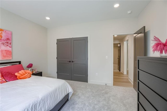 12435 NW Arbor Way, Platte City, MO 64079 - bedroom featuring recessed lighting, light carpet, and a closet