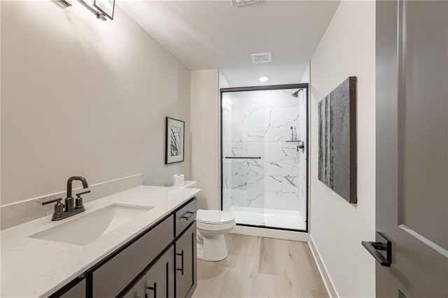 12435 NW Arbor Way, Platte City, MO 64079 - bathroom with wood finished floors, a marble finish shower, vanity, and recessed lighting