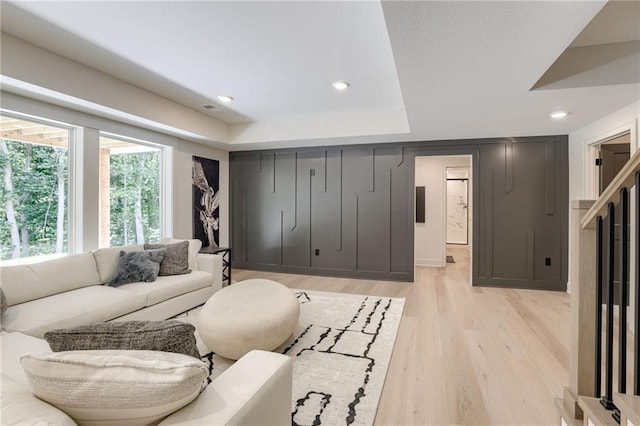 12435 NW Arbor Way, Platte City, MO 64079 - living area featuring light wood-style flooring, recessed lighting, and a tray ceiling