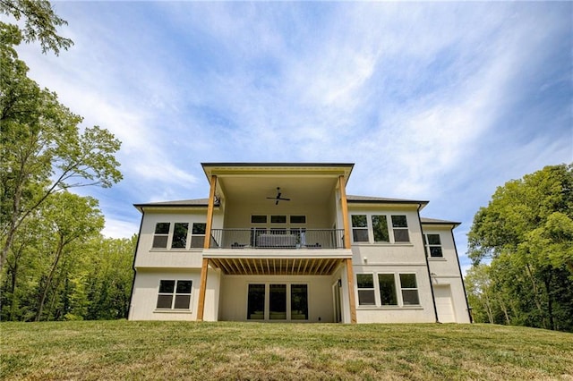 12435 NW Arbor Way, Platte City, MO 64079 - rear view of house with a yard, a balcony, ceiling fan, and stucco siding