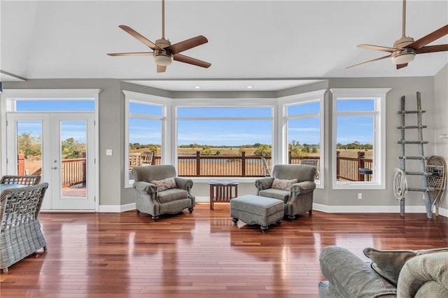 sunroom / solarium featuring french doors and a ceiling fan