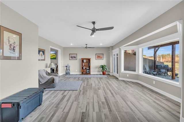 interior space with recessed lighting, baseboards, ceiling fan, and light wood finished floors