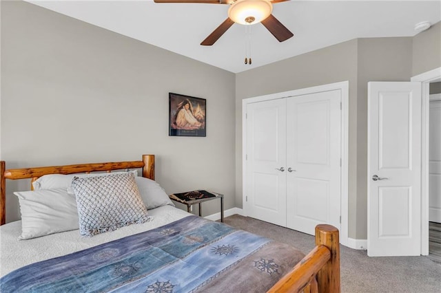 bedroom with a closet, carpet, a ceiling fan, and baseboards