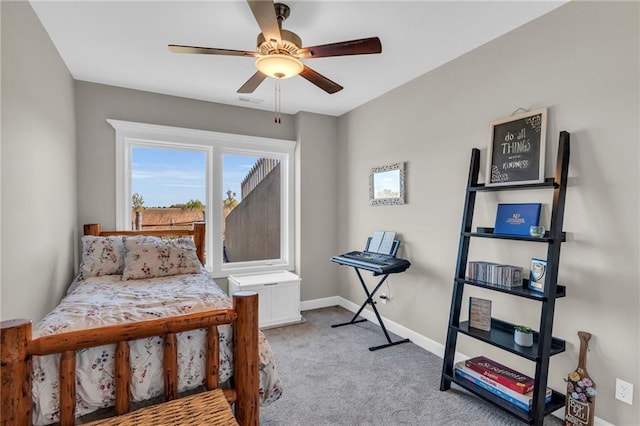 bedroom featuring baseboards, a ceiling fan, and light colored carpet