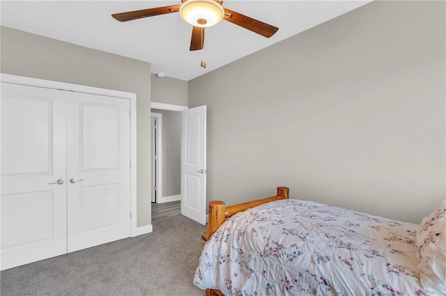 bedroom featuring a ceiling fan, carpet, a closet, and baseboards